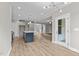 Spacious kitchen with an island and views into the living room at 190 Whistlers Cv, Louisburg, NC 27549