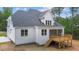 Two-story house with white siding, gray roof, and a deck at 190 Whistlers Cv, Louisburg, NC 27549