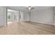 Open living area showcasing hardwood flooring and access to other rooms at 190 Whistlers Cv, Louisburg, NC 27549