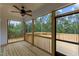 Screened porch with wooden deck and wooded views at 190 Whistlers Cv, Louisburg, NC 27549