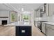 Open concept kitchen features a large island and stainless steel appliances at 190 Whistlers Cv, Louisburg, NC 27549