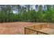 View of backyard from deck, showing wooded area at 190 Whistlers Cv, Louisburg, NC 27549