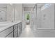 Elegant bathroom with double vanity, marble shower, and separate tub at 190 Whistlers Cv, Louisburg, NC 27549