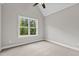 Bright bedroom with vaulted ceiling and window at 190 Whistlers Cv, Louisburg, NC 27549