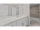 Bathroom with white vanity, quartz countertop and shower/tub combo at 190 Whistlers Cv, Louisburg, NC 27549