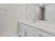 Bathroom vanity with white cabinets and quartz countertop at 190 Whistlers Cv, Louisburg, NC 27549