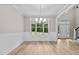 Dining room with hardwood floors, wainscoting, and a view of the backyard at 190 Whistlers Cv, Louisburg, NC 27549