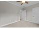 Bedroom with carpet, ceiling fan, and double closets at 190 Whistlers Cv, Louisburg, NC 27549