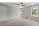 Bedroom with carpet, ceiling fan and two windows at 190 Whistlers Cv, Louisburg, NC 27549
