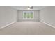 Upstairs bedroom with ceiling fan and carpeting at 190 Whistlers Cv, Louisburg, NC 27549