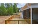 Wooden deck attached to a screened porch at 190 Whistlers Cv, Louisburg, NC 27549