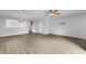 Bright living room featuring wood-look floors and a ceiling fan at 3915 Swinton St, Raleigh, NC 27616