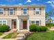 Two-story townhome with brown door and landscaping at 3915 Swinton St, Raleigh, NC 27616