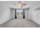 Spacious main bedroom with ceiling fan and large window at 3915 Swinton St, Raleigh, NC 27616