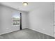 Well-lit bedroom featuring a window with blinds at 3915 Swinton St, Raleigh, NC 27616