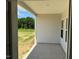 Covered porch offers peaceful views of the backyard at 91 Bristow Ct # 52, Four Oaks, NC 27524