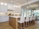 Modern kitchen with island, stainless steel appliances, and white cabinetry at 140 Pondhurst Ln, Fuquay Varina, NC 27526