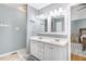 Double vanity bathroom with a view into the bedroom at 221 Southerby Dr, Garner, NC 27529