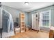 Bedroom with wood shelving and large window at 221 Southerby Dr, Garner, NC 27529