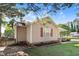 Side view of the house, showcasing red shutters and stonework at 221 Southerby Dr, Garner, NC 27529