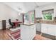 Eat-in kitchen with island, stainless steel appliances, and white cabinetry at 221 Southerby Dr, Garner, NC 27529