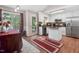 Kitchen features an island, stainless steel appliances, and white cabinets at 221 Southerby Dr, Garner, NC 27529