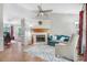 Spacious living room with hardwood floors and fireplace at 221 Southerby Dr, Garner, NC 27529