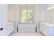 Modern bathroom with freestanding tub and double vanity at 1817 N Lakeshore Dr, Chapel Hill, NC 27514