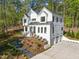 Two-story home with attached garage and landscaped yard at 1817 N Lakeshore Dr, Chapel Hill, NC 27514