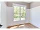 Bright home office featuring hardwood floors and large window at 1817 N Lakeshore Dr, Chapel Hill, NC 27514