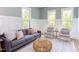 Bright living room features a comfy sofa, armchairs, and a coffee table at 1817 N Lakeshore Dr, Chapel Hill, NC 27514