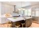 Modern kitchen boasts stainless steel appliances and a large island at 1817 N Lakeshore Dr, Chapel Hill, NC 27514