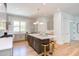 Modern kitchen with gray cabinets, white quartz countertops, and island at 1817 N Lakeshore Dr, Chapel Hill, NC 27514
