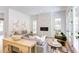 Living area featuring a stone fireplace and view of backyard at 1817 N Lakeshore Dr, Chapel Hill, NC 27514