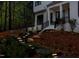 Elegant front entry with lighted steps leading to the front door at 1817 N Lakeshore Dr, Chapel Hill, NC 27514