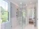 Spa-like shower with glass enclosure and built-in seat at 1817 N Lakeshore Dr, Chapel Hill, NC 27514