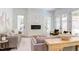 Living room with stone fireplace and access to backyard patio at 1817 N Lakeshore Dr, Chapel Hill, NC 27514