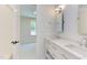Bathroom with double vanity, quartz countertop, and white subway tile at 1817 N Lakeshore Dr, Chapel Hill, NC 27514