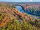 Home nestled on a wooded lot with lake views at 1817 N Lakeshore Dr, Chapel Hill, NC 27514