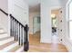 Elegant staircase with black spindles and hardwood treads at 1817 N Lakeshore Dr, Chapel Hill, NC 27514