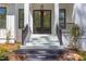 Modern front entrance with double doors and stylish black railings at 1817 N Lakeshore Dr, Chapel Hill, NC 27514