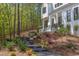 Stunning home exterior with landscaped walkway leading to the front entrance at 1817 N Lakeshore Dr, Chapel Hill, NC 27514