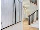 Elegant staircase with black spindles and a large piece of art at 1817 N Lakeshore Dr, Chapel Hill, NC 27514
