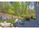 Private backyard patio with seating area and outdoor dining furniture at 1817 N Lakeshore Dr, Chapel Hill, NC 27514