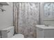 Bathroom with a shower/tub combo, toilet, and vanity at 221 Stroud St, Sanford, NC 27330