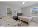 Bedroom with twin and full beds, and plenty of natural light at 221 Stroud St, Sanford, NC 27330