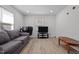 Cozy living room featuring a gray couch and a coffee table at 221 Stroud St, Sanford, NC 27330