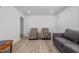 Bright living room with two armchairs and a gray couch at 221 Stroud St, Sanford, NC 27330