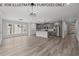 Open concept dining room with large windows and modern lighting at 210 Lilliput Ln, Wake Forest, NC 27587