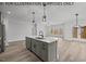 Open concept kitchen with island and stainless steel appliances at 210 Lilliput Ln, Wake Forest, NC 27587
